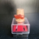 Fingerhut aus Holz, mit rotem Holzschuh