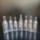 7 Mini Flaschenfiguren. Männer in Uniform