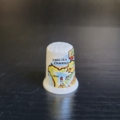 Fingerhut, weiß, mit bunten, ländertypischen Motiven