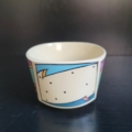 Tasse, eckig-rund, cremeweiß, mit 3 eckig bunten Motiven außen